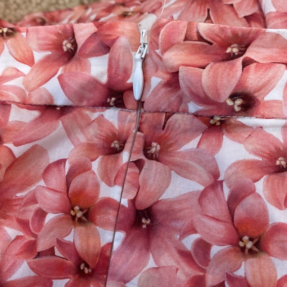 Midi pink floral skirt with bottom flare. It's not stretchy like at all. - Picture 2 of 2